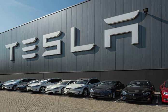 489388897 featured image Tesla facility with parked cars in front