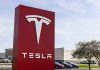 Tesla sign in front of dealership