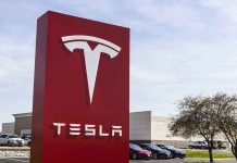 Tesla sign in front of dealership