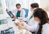 Doctors discussing chest X ray results at a workstation