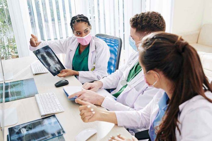 Doctors discussing chest X ray results at a workstation