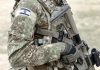 Soldier in camouflage gear with Israeli flag patch