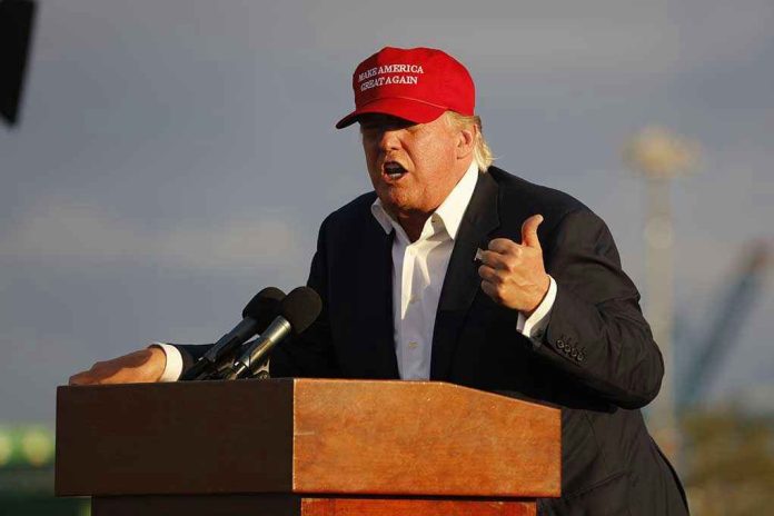 Person speaking at a podium wearing a red hat