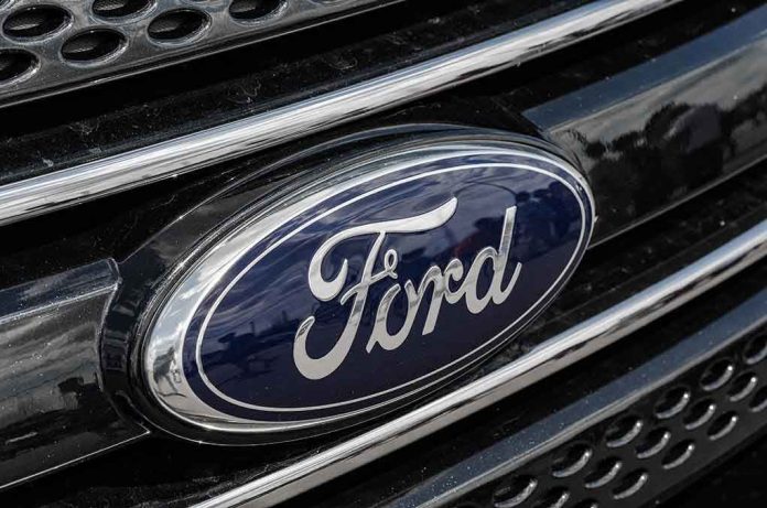 589569923 Ford logo on car grille close-up.