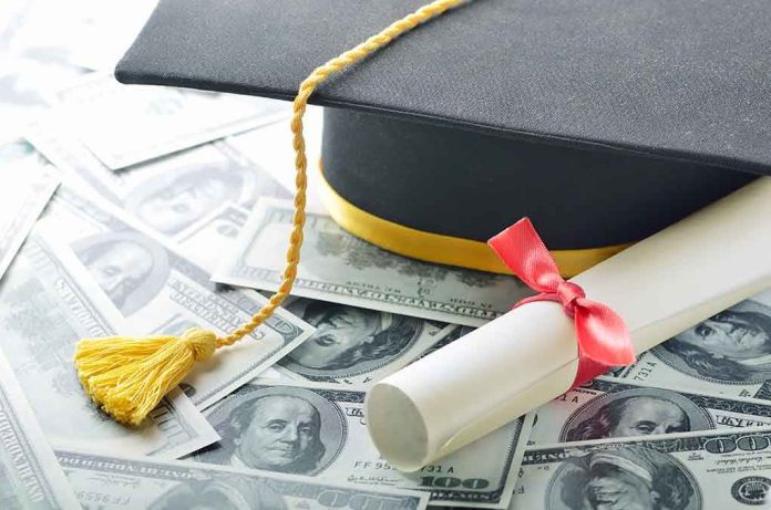 Graduation cap and diploma resting on a pile of money