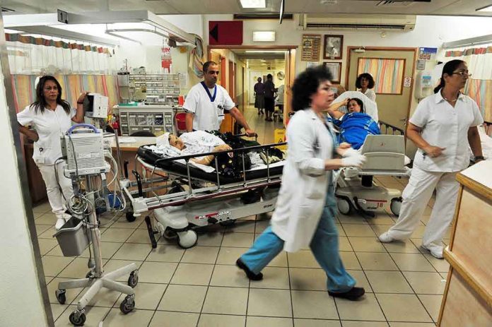 shutterstock_144372544.jpg Medical staff attending to patients in a busy hospital emergency room