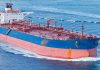 Large cargo ship navigating through the ocean
