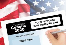 Hand filling out the U.S. Census 2020 form