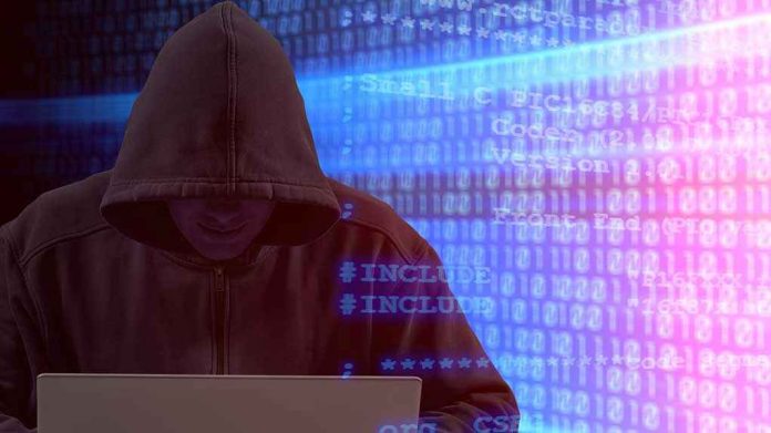 1951632418 Person in hoodie using laptop, surrounded by digital code.