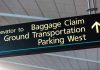 Airport sign for Baggage Claim and other destinations