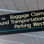 Airport sign for Baggage Claim and other destinations