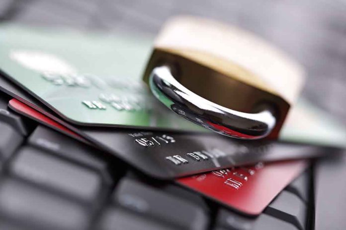 shutterstock_145450405.jpg A padlock resting on top of multiple credit cards on a keyboard