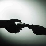 $130 Million Donation Exposes SHOCKING Military Crisis Silhouette of hands exchanging money in dim light