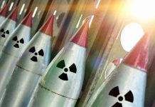 Criminal Uranium Deal Rattles GLOBAL Security Line of nuclear missiles with radiation hazard signs