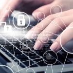 Nuclear Worker BUSTED With Explicit Content Hands typing with cybersecurity icons overlay
