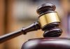 Judges gavel striking a sound block