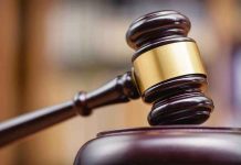 Judges gavel striking a sound block