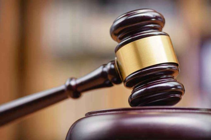 1334292137 Judges gavel striking a sound block