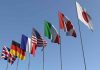 French Navy OPENS FIRE on Drug Runners Flags of seven countries against clear blue sky.
