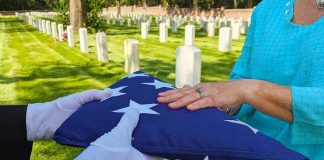 Flag folded and handed over at gravesite ceremony