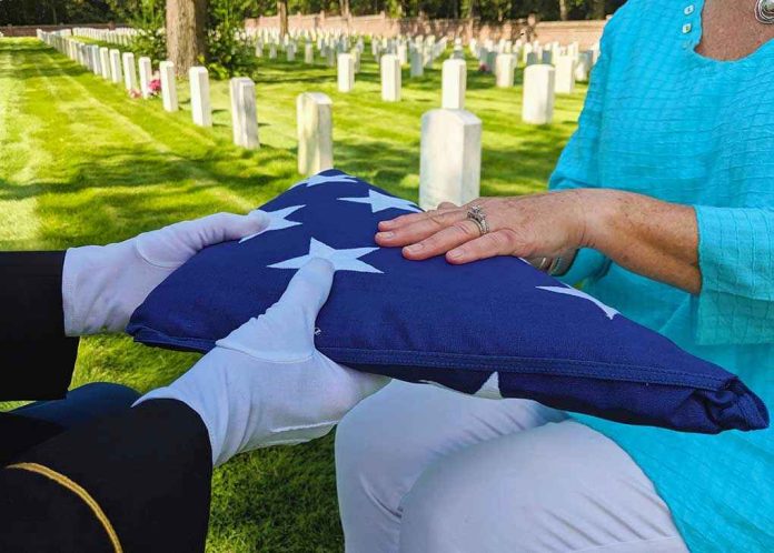 1575982354 Flag folded and handed over at gravesite ceremony