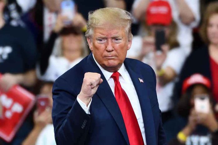 1585235176 Man in suit making a fist gesture at rally