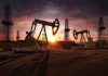 Massive Oil Disruption Looms: Russia on the Brink Oil rigs operating at sunset in a desert landscape
