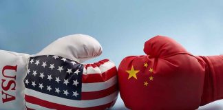 USA and China boxing gloves facing each other
