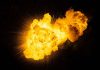 Bright fiery explosion against a dark background