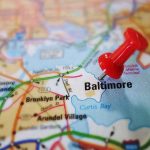 Red pushpin marking Baltimore on a map