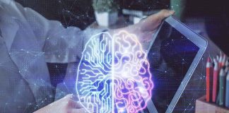 Futuristic AI brain hologram above a laptop computer