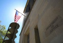 ANOTHER DOJ Referral: Political Storm Brewing American flag at Department of Justice building exterior