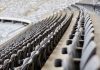 Empty rows of gray seats in a stadium