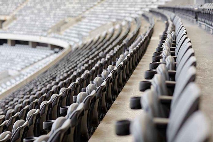 254951527 Empty rows of gray seats in a stadium