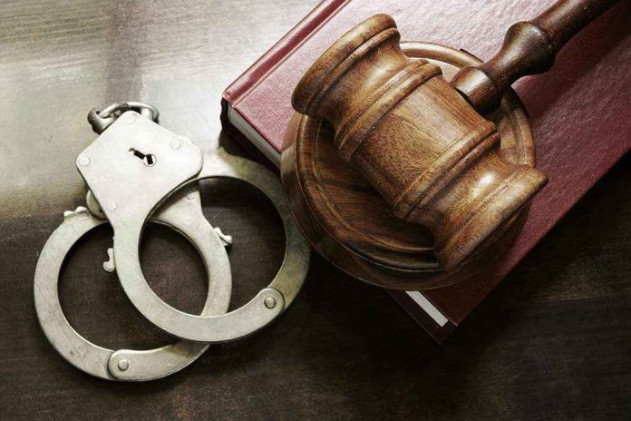 302738369 Handcuffs beside a gavel on a book