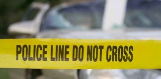 ICE Chase Turns Fatal — Tragedy on Highway Yellow police tape in front of a car