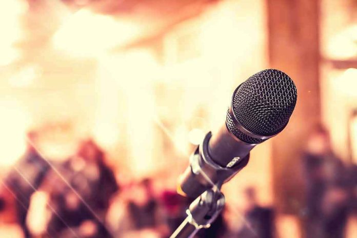 347902208 Close up of microphone with blurred audience background