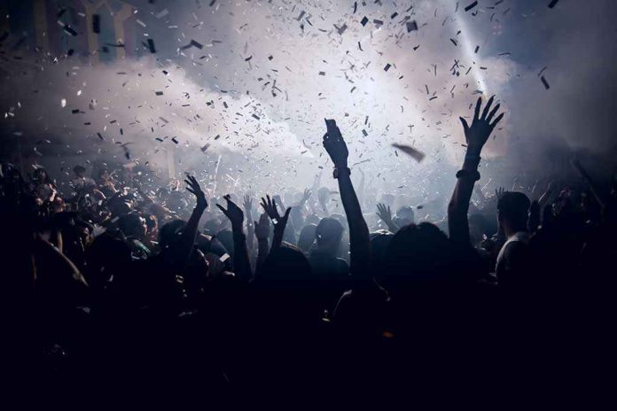 420455902 Crowd celebrating under confetti and bright lights.