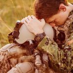 TRUMP RAIDS Pentagon War Chest – Troops’ Crisis Soldier sitting leaning head on helmet