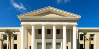 Exterior view of the Supreme Court of Florida with columns and palm trees