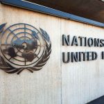 UN’s Grip on US Borders SHATTERED! Facade of the United Nations building featuring the UN emblem and text