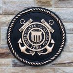 Trump Shocks with Cyber-Savvy Coast Guard Nominee Bronze emblem of the United States Coast Guard mounted on a stone wall