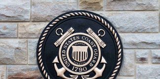 Trump Shocks with Cyber-Savvy Coast Guard Nominee Bronze emblem of the United States Coast Guard mounted on a stone wall