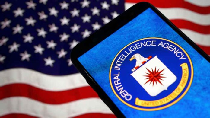 shutterstock_2428513619 CIA logo displayed on smartphone with American flag