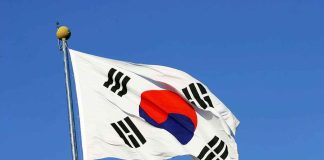 South Korean flag waving against a clear blue sky