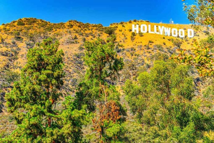 1356693626 Hollywood sign on hillside with trees in foreground