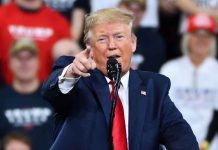 Meyers’ Anti-Trump Skit: “Probably Illegal” Says Trump Man in suit pointing speaking at a rally