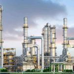 Industrial plant with metal towers and pipes