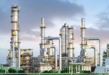 Industrial plant with metal towers and pipes