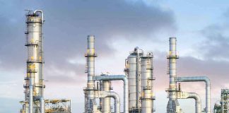 Industrial plant with metal towers and pipes